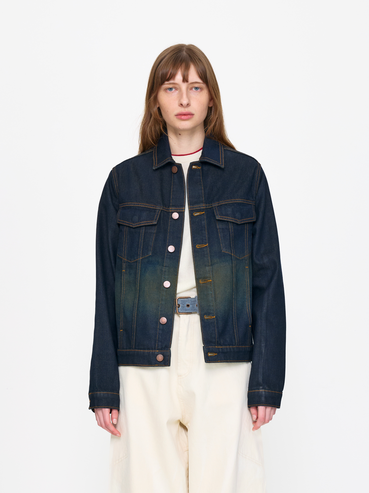 Person wearing a dark blue denim jacket on a white background