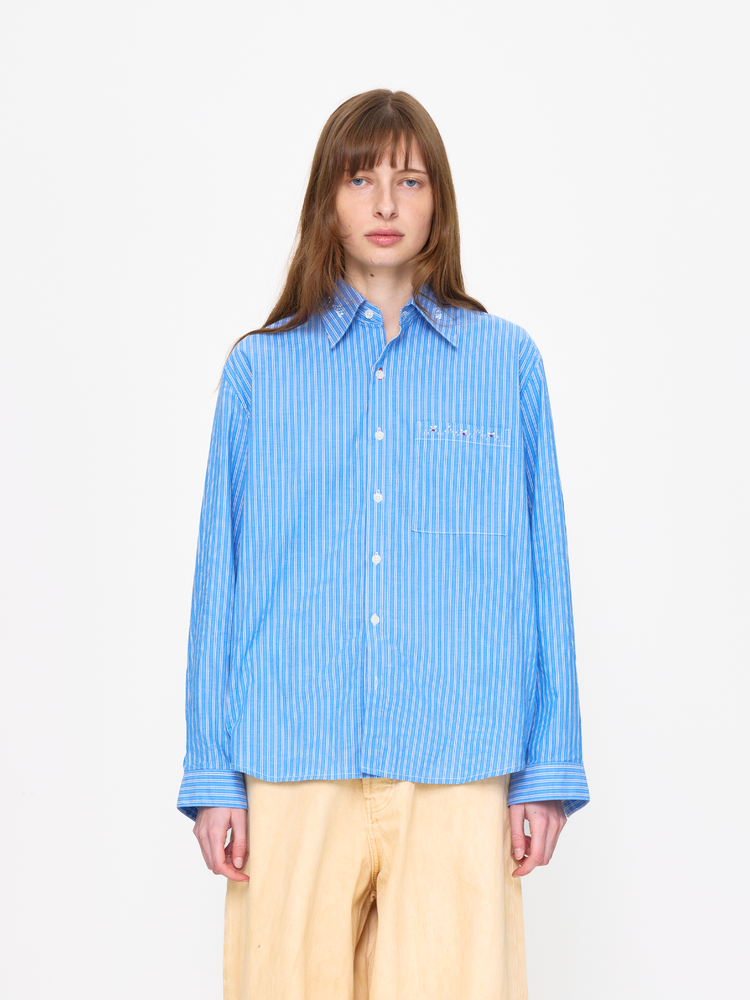 Person wearing a blue striped shirt on a white background